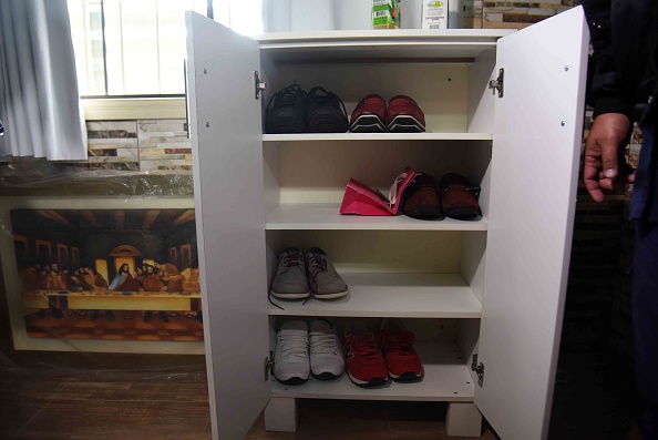 View of shoes at Brazilian drug trafficker Jarvis Chimenes Pavao's cell at Tacumbu prison in Asuncion on July 28, 2016. Three rooms, a plasma TV, a library, and even a collection of DVDs of Colombian Pablo Escobar TV series, Jarvis Pavao Chimenes lived in a luxury cell in Tacumbu prison, one of the most crowded of Paraguay. / AFP / NORBERTO DUARTE / TO GO WITH AFP STORY (Photo credit should read NORBERTO DUARTE/AFP/Getty Images)