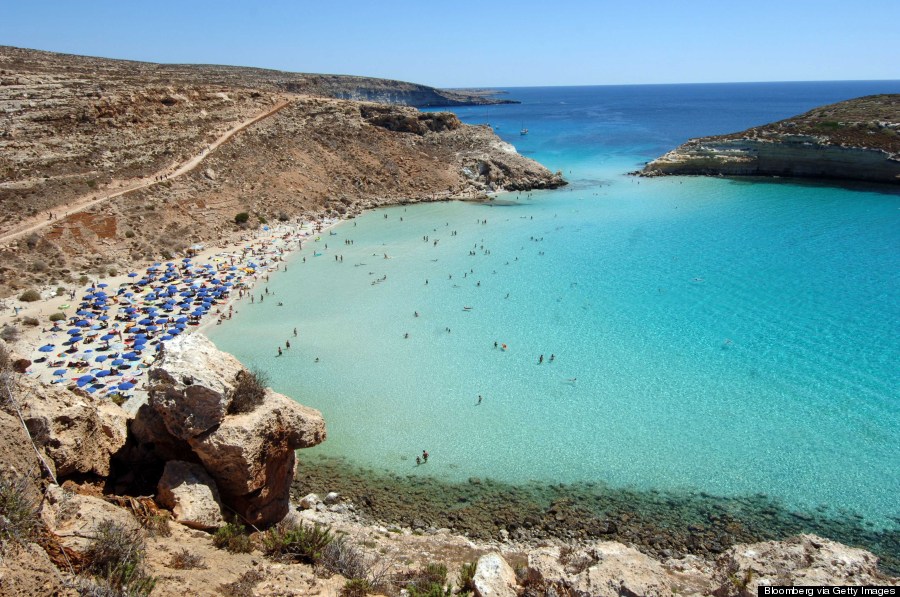 ITALY - SEPTEMBER 04:  The "Spiaggia dei Conigli" or Rabbit Beach in Lampedusa, Italy, Monday, September 4, 2006. With its sun-kissed beaches and crystal-clear sea, Lampedusa could be a playground for the rich and famous. Instead, the 20-square-kilometer Italian island is becoming known for immigrants' bodies washing ashore. Chris Warde-Jones/Bloomberg News.  (Photo by Chris Warde Jones/Bloomberg via Getty Images)