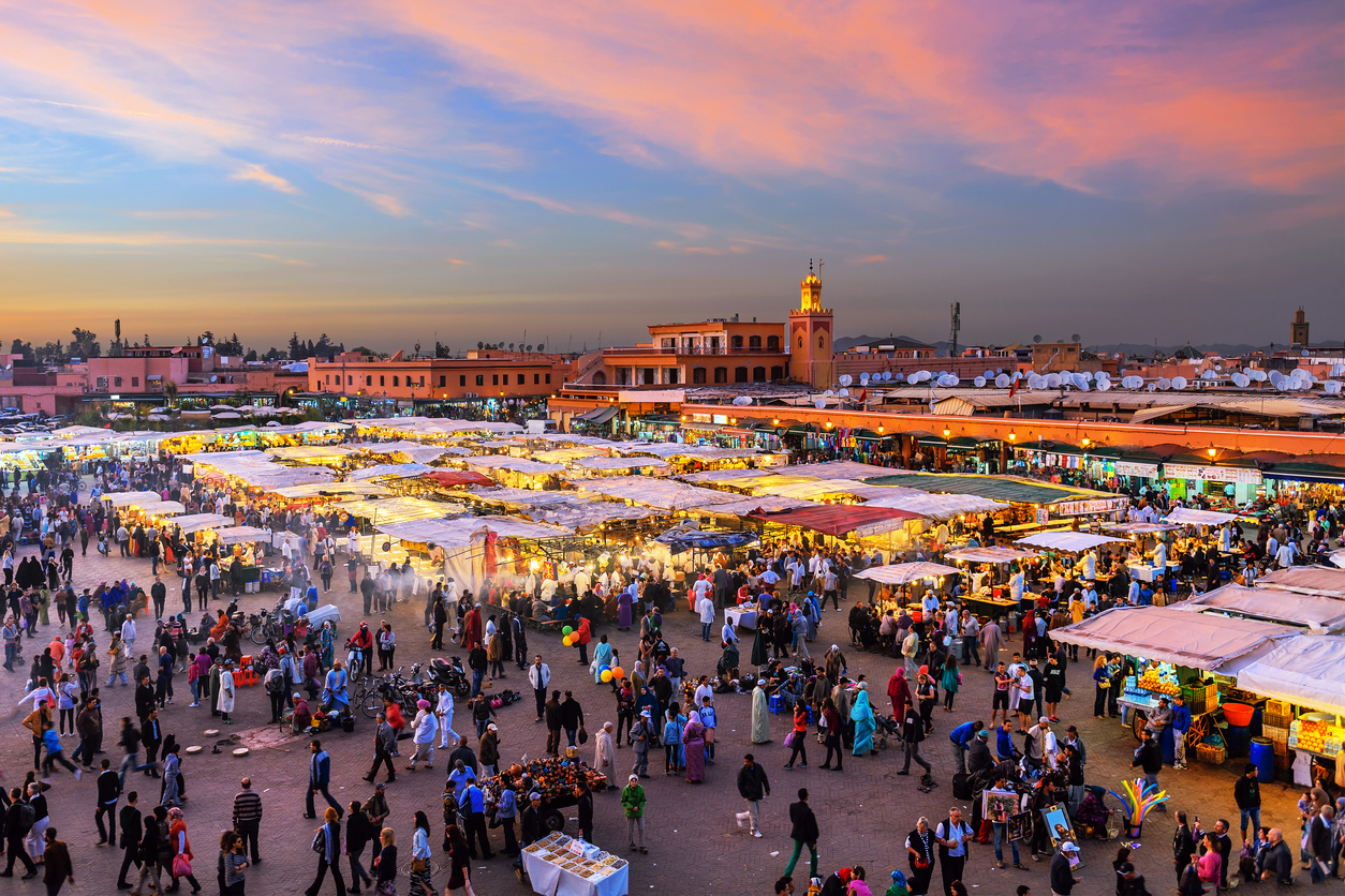 Famous Djemaa El Fna Square in early evening light, Marrakech, Morocco with the Koutoubia Mosque, Northern Africa.Nikon D3x